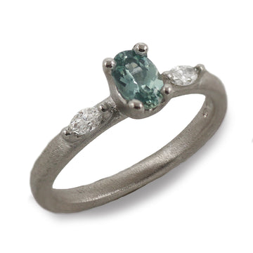 Platinum Ring with a Blue Sapphire and Marquise Cut Diamonds