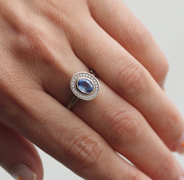 White Gold Oval Shaped Blue Sapphire and Diamond Halo Ring