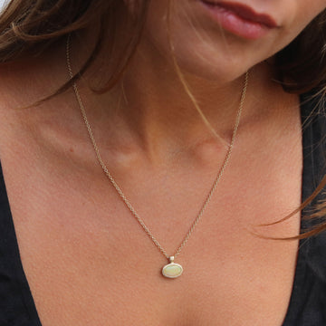 Textured Yellow Gold Pendant Set With an Australian Opal