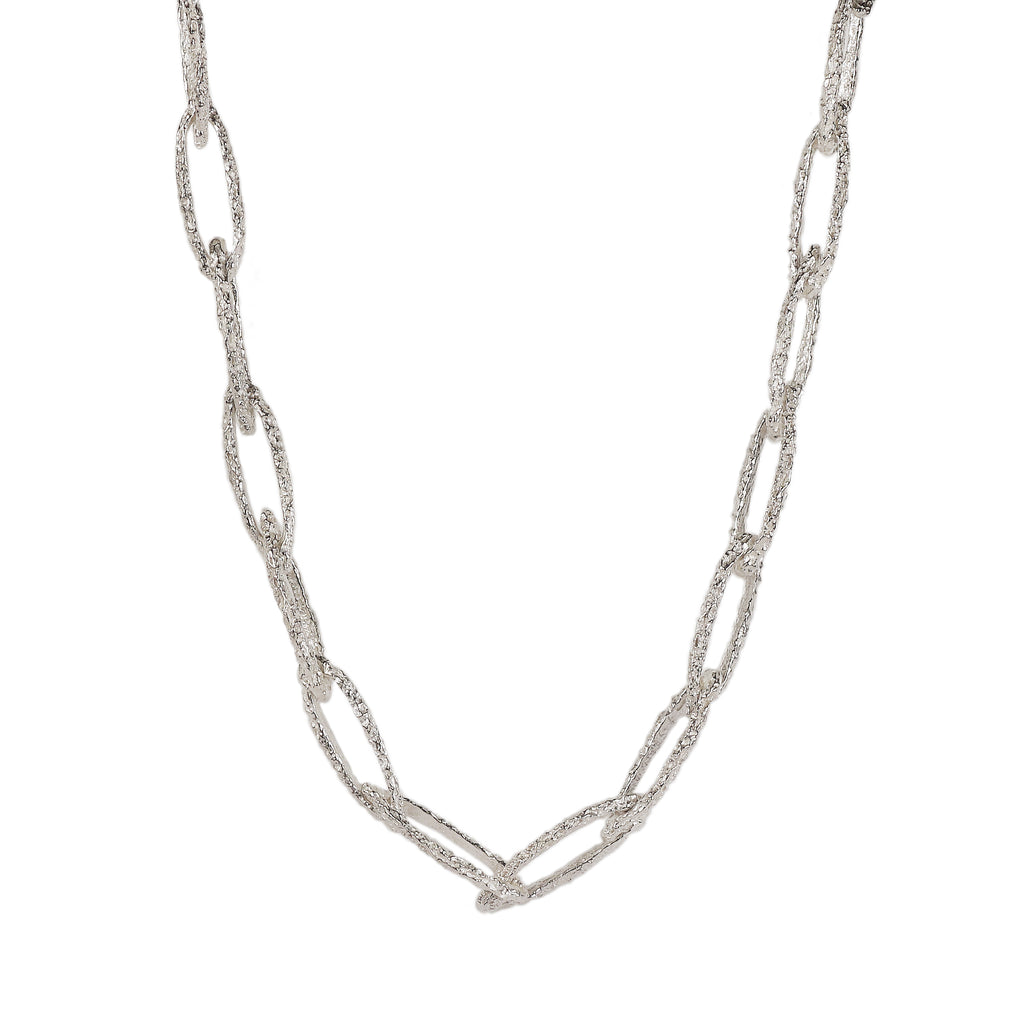 silver textured organic silver link necklace on a white background 