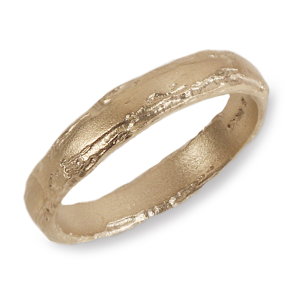A textured yellow gold wedding ring