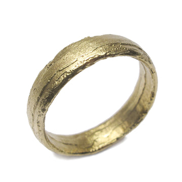 Diana Porter Jewellery unique green gold wedding ring on white background