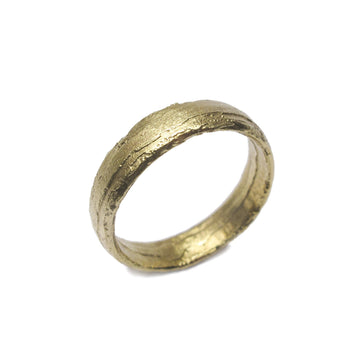 Diana Porter Jewellery unique green gold wedding ring on white background