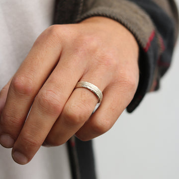 Textured Wedding Ring 6mm in 9ct white Fairtrade gold worn on male hand