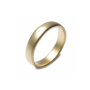 A plain 18ct Fairtrade Yellow Gold wedding ring displayed on a white background