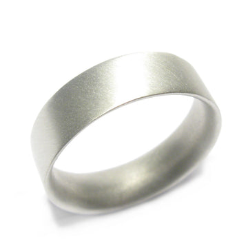 Wide, men's 9ct white gold ring displayed on white background