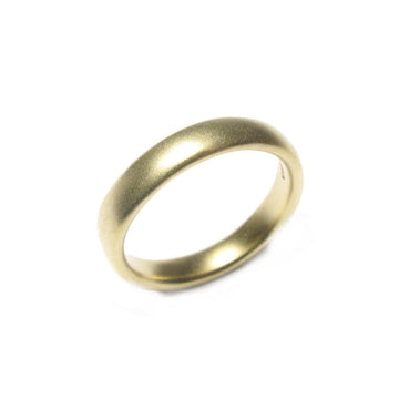 a narrow 18ct yellow gold wedding ring with matt finish on white background