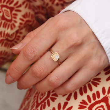 Textured Yellow Gold Ring with Princess Cut Diamond  worn on hand