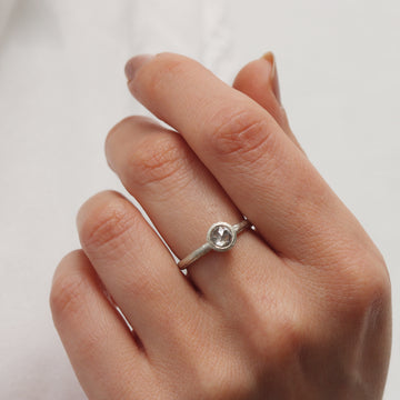 Textured White Gold set with a Grey Rose Cut Diamond worn on hand