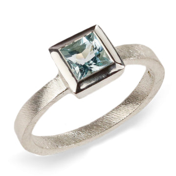White Gold Ring with Blue Princess Cut Aquamarine  on white background