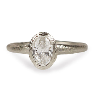 White Gold Engagement Ring Set with Oval Lab Grown Diamond on white background