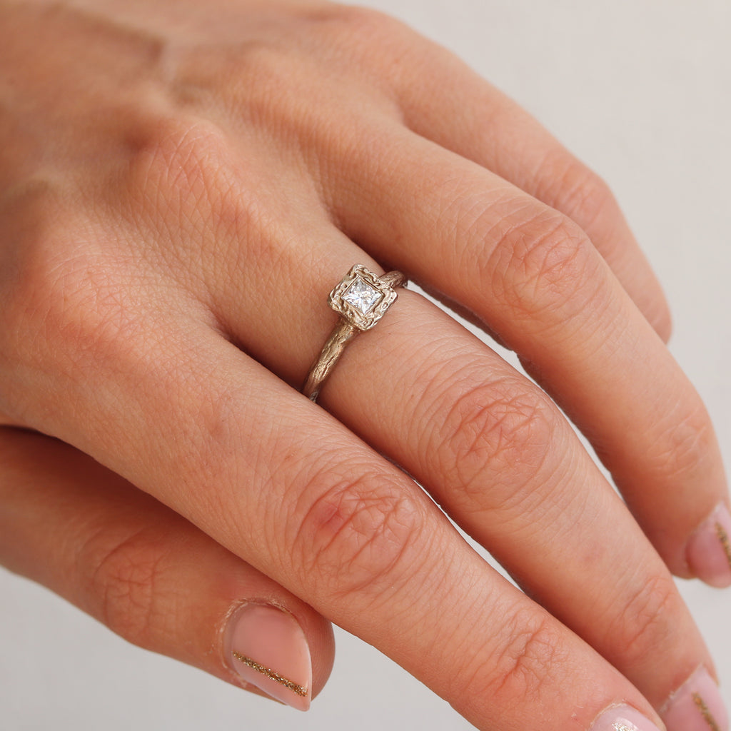 Textured White Gold Engagement Ring with Princess Cut Diamond  worn on hand 