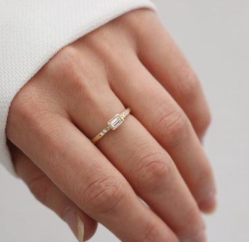 Yellow Gold Textured Ring with a Baguette and Round Diamonds