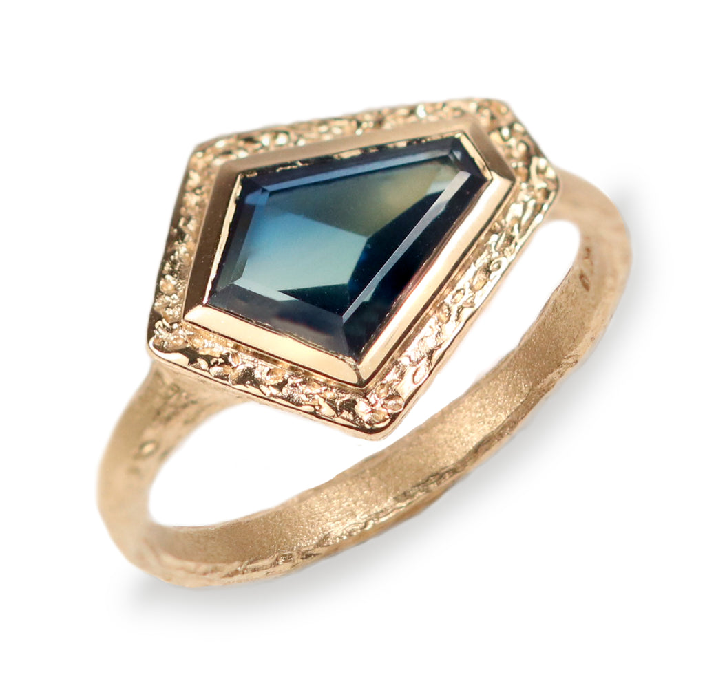 Yellow Gold Alternative Ring with Australian Shield Sapphire on white background. 