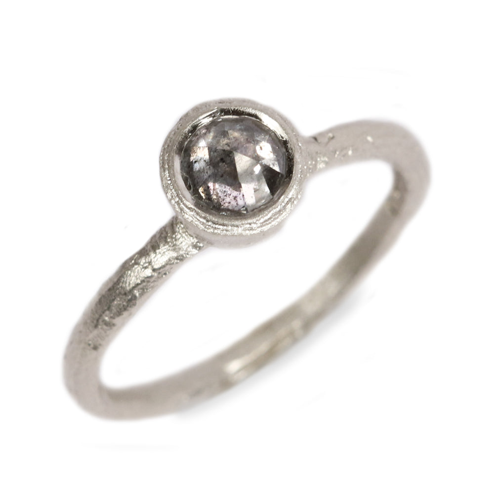 Textured White Gold set with a Grey Rose Cut Diamond on white background 