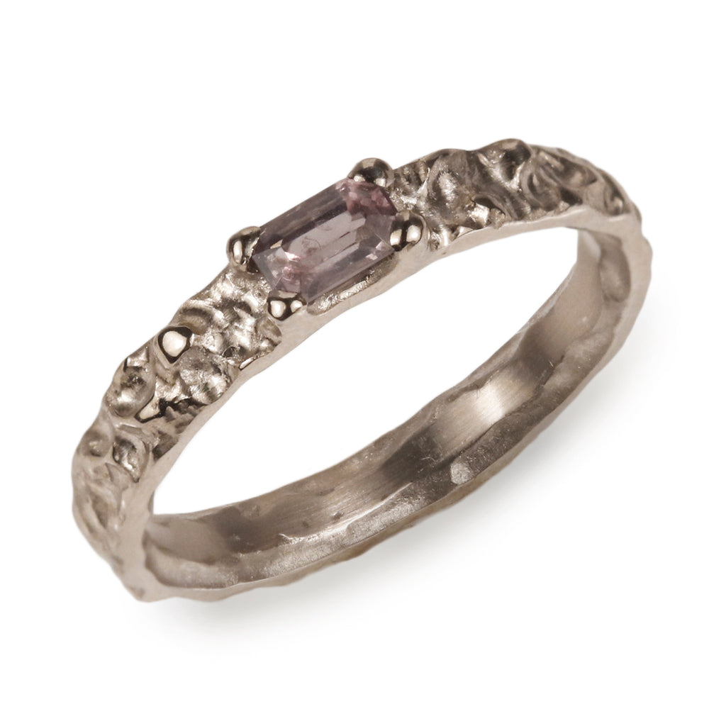 Modern Molten Ring with Purple Tanzanian Spinel on white background 