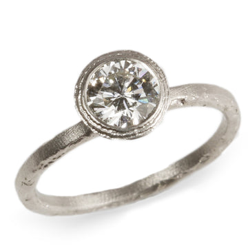 Solitaire Diamond and Platinum Engagement Ring  on white background