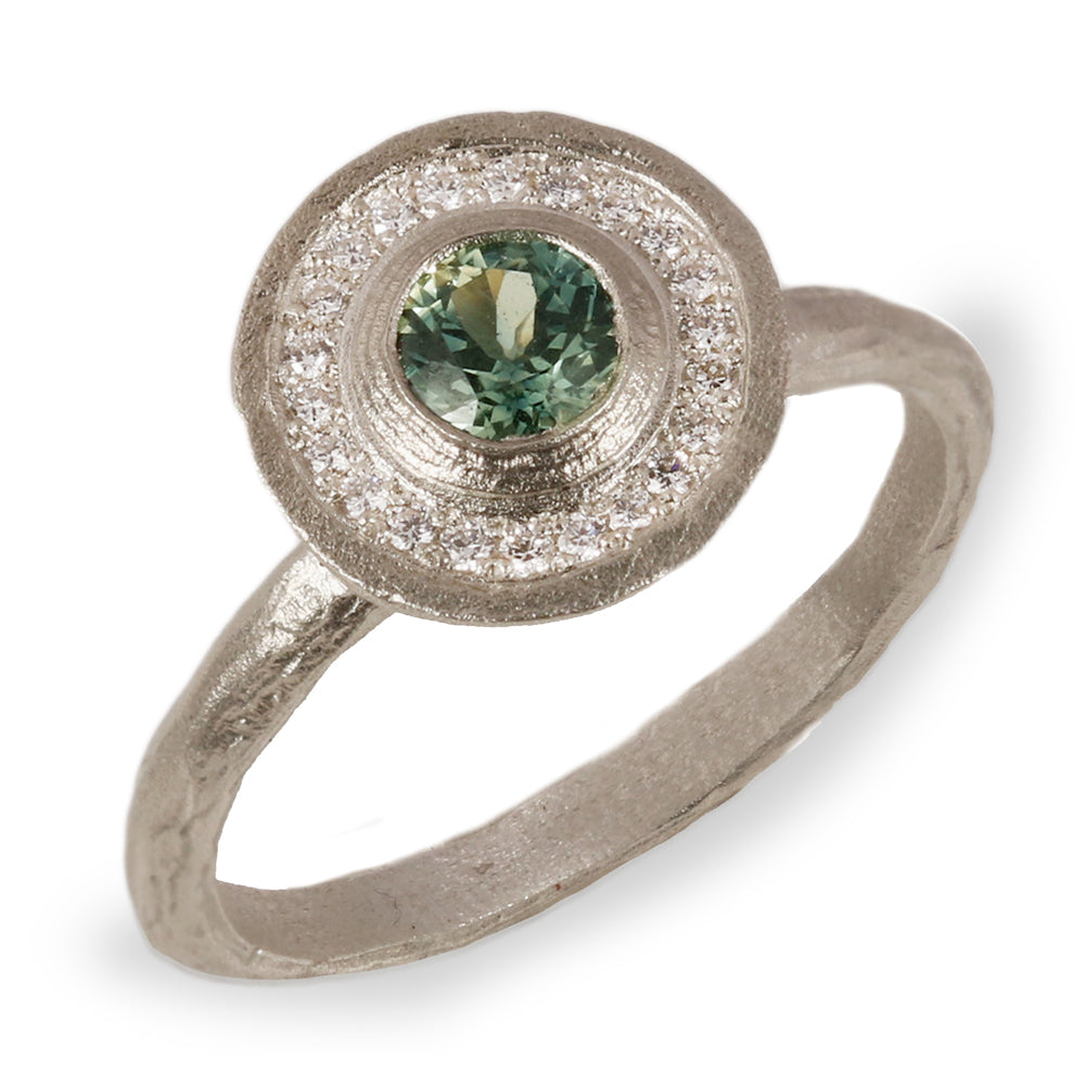  White Gold Halo Engagement Ring with a Green Sapphire and Halo of Diamonds on white background 