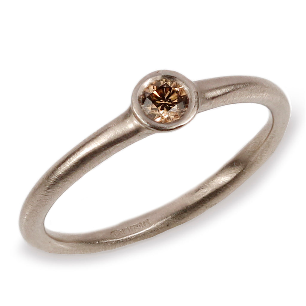 White Gold Ring with Single Champagne Diamond on white background 
