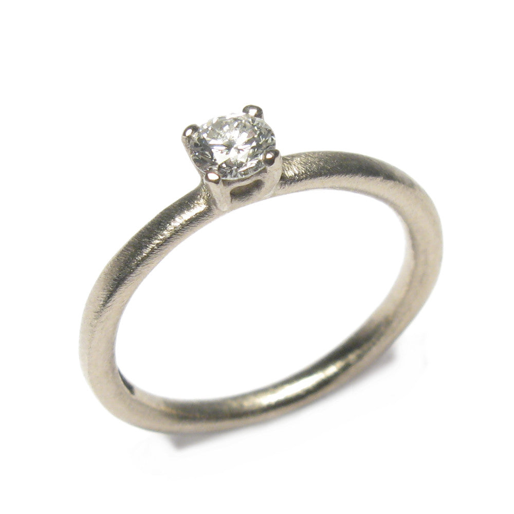 White Gold Ring with Claw Set Single White Diamond  on white background 