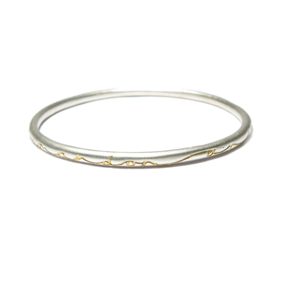 Diana Porter etched on and on silver gold bangle