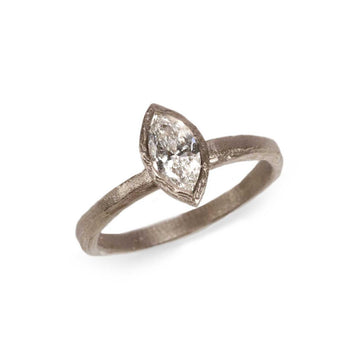 White Gold with a Marquise Cut Diamond on white background