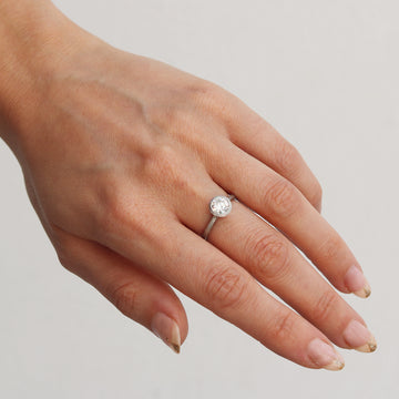 Solitaire Diamond and Platinum Engagement Ring  worn on hand