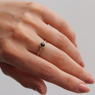 Yellow Gold Solitaire Ring with Black Rose Cut Diamond worn on hand 