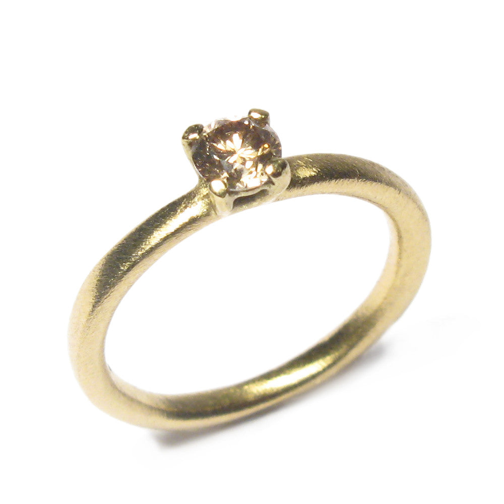 Yellow Gold Ring with Claw Set Single Champagne Diamond on white background 