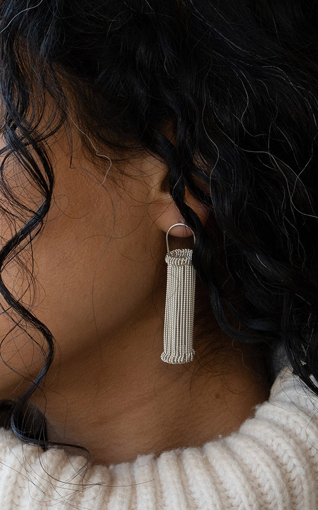 Ruth Leslie Heddle Earrings  worn on model with curly hair for Summer Statements Exhibition