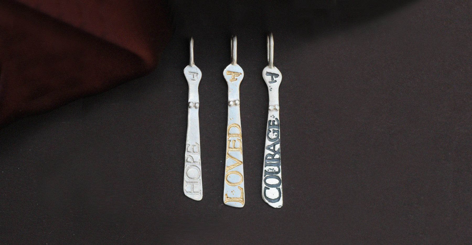 Three silver sibyls with etched words | Diana Porter Jewellery