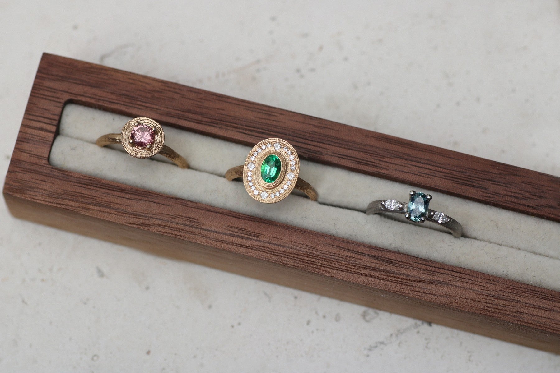 Contemporary rings designed by Diana Porter in a wooden presentation box