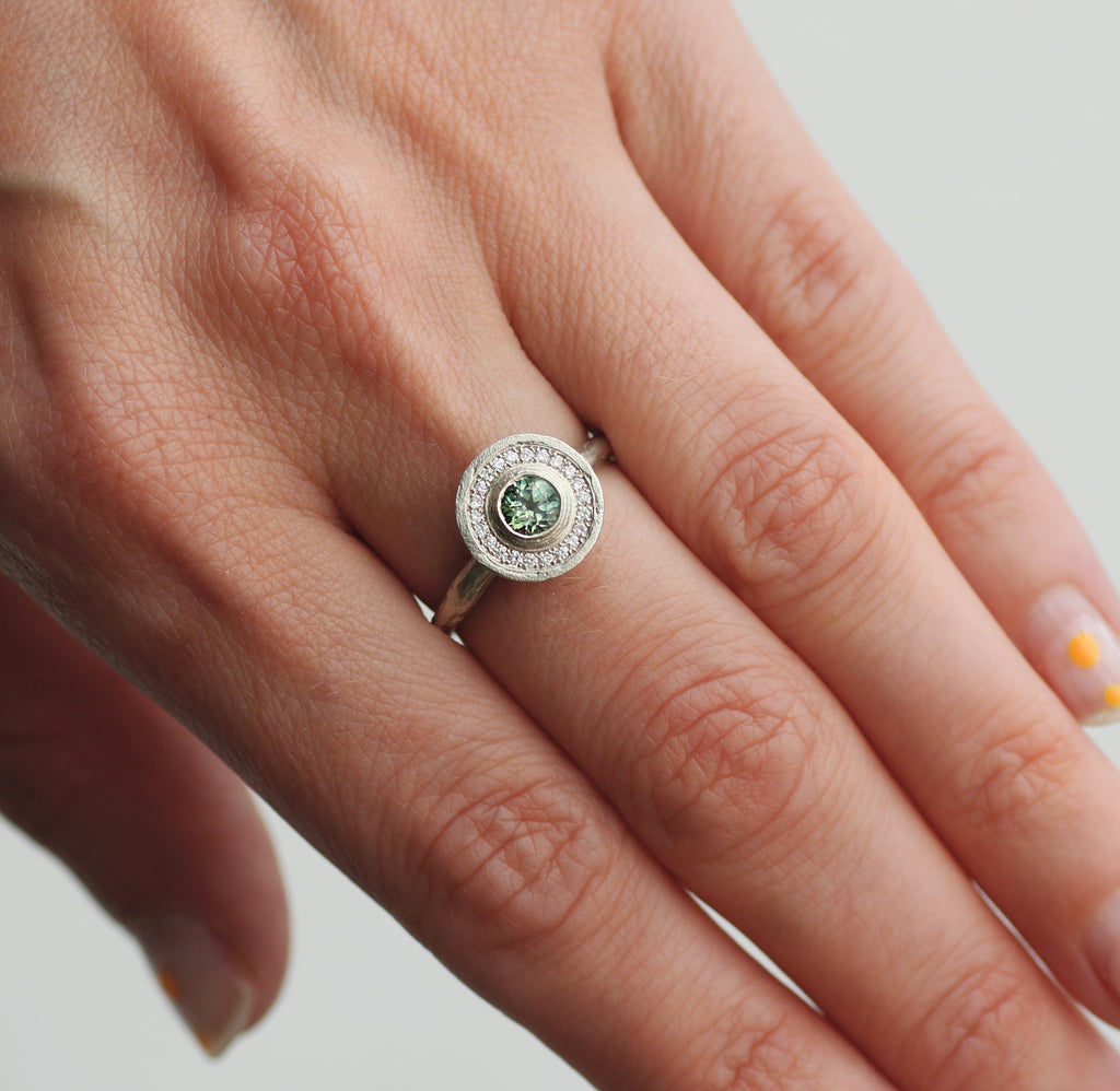 9ct Fairtrade White Gold Ring with a Green Sapphire and Halo of Diamonds