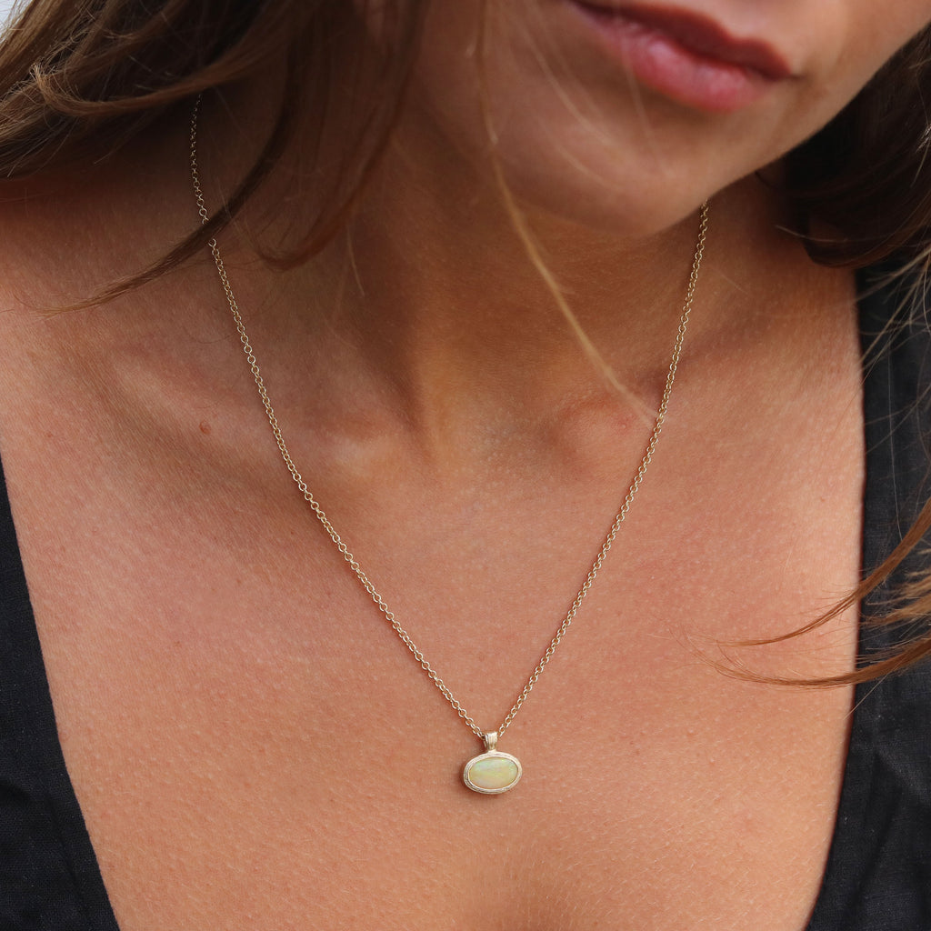 Textured Yellow Gold Pendant Set With an Australian Opal