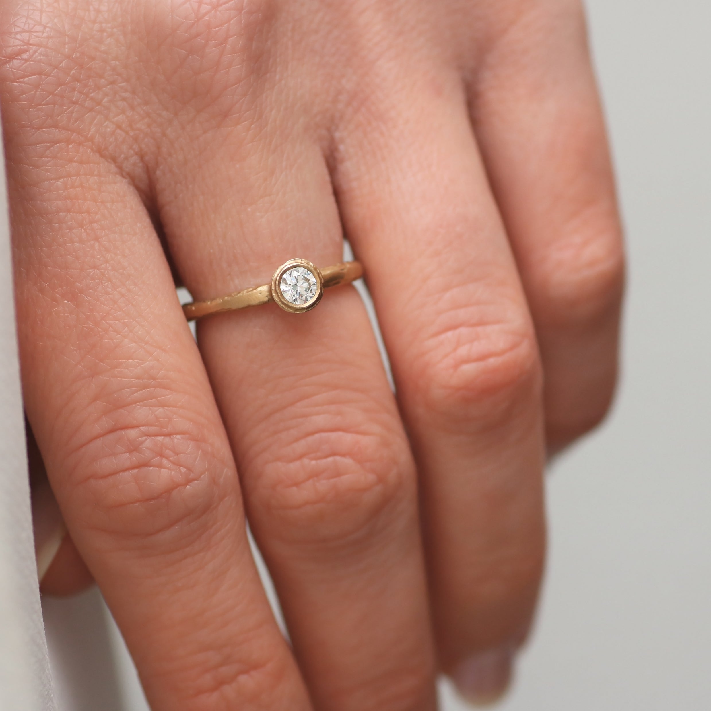 Solitaire Gold Textured Ring with Brilliant Cut Diamond