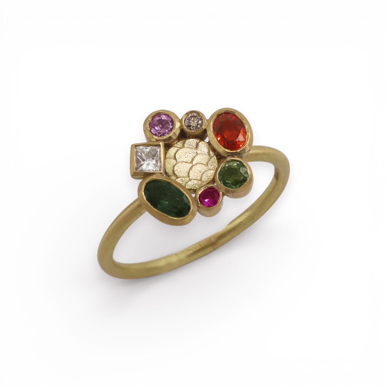 Gold ring with multicolored gemstones on a white background