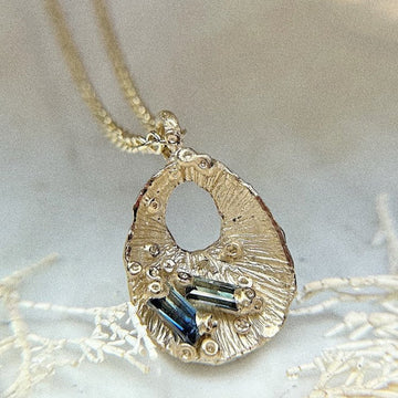 Ami Pepper Yellow Gold Limpet Shell Pendant with Sapphires