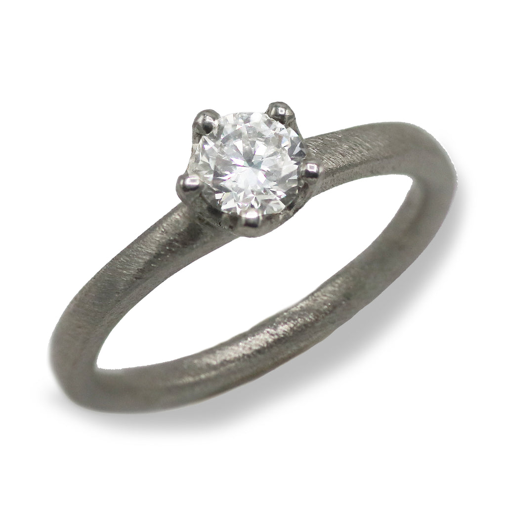 Platinum Ring Set with a Brilliant Cut Diamond in an Irregular Claw Setting