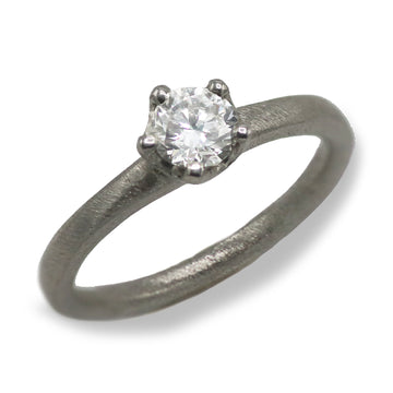 Platinum Ring Set with a Brilliant Cut Diamond in an Irregular Claw Setting