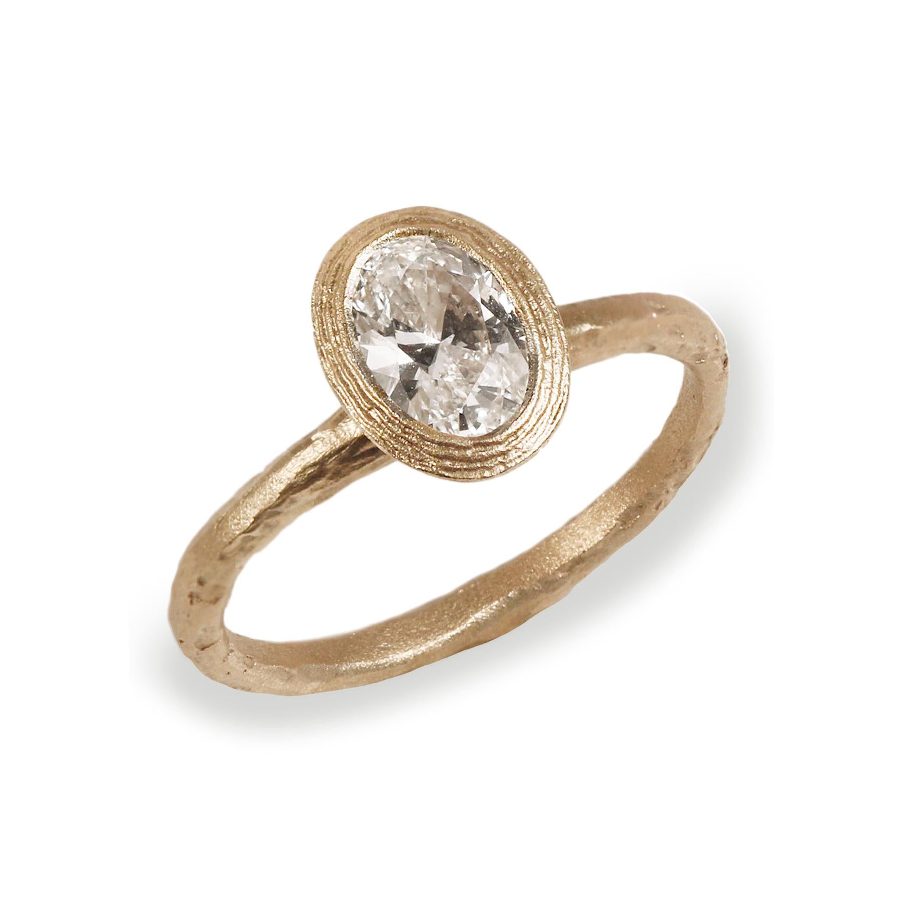 Yellow Gold Engagement Ring Set with Oval Cut Lab Grown Diamond on white background