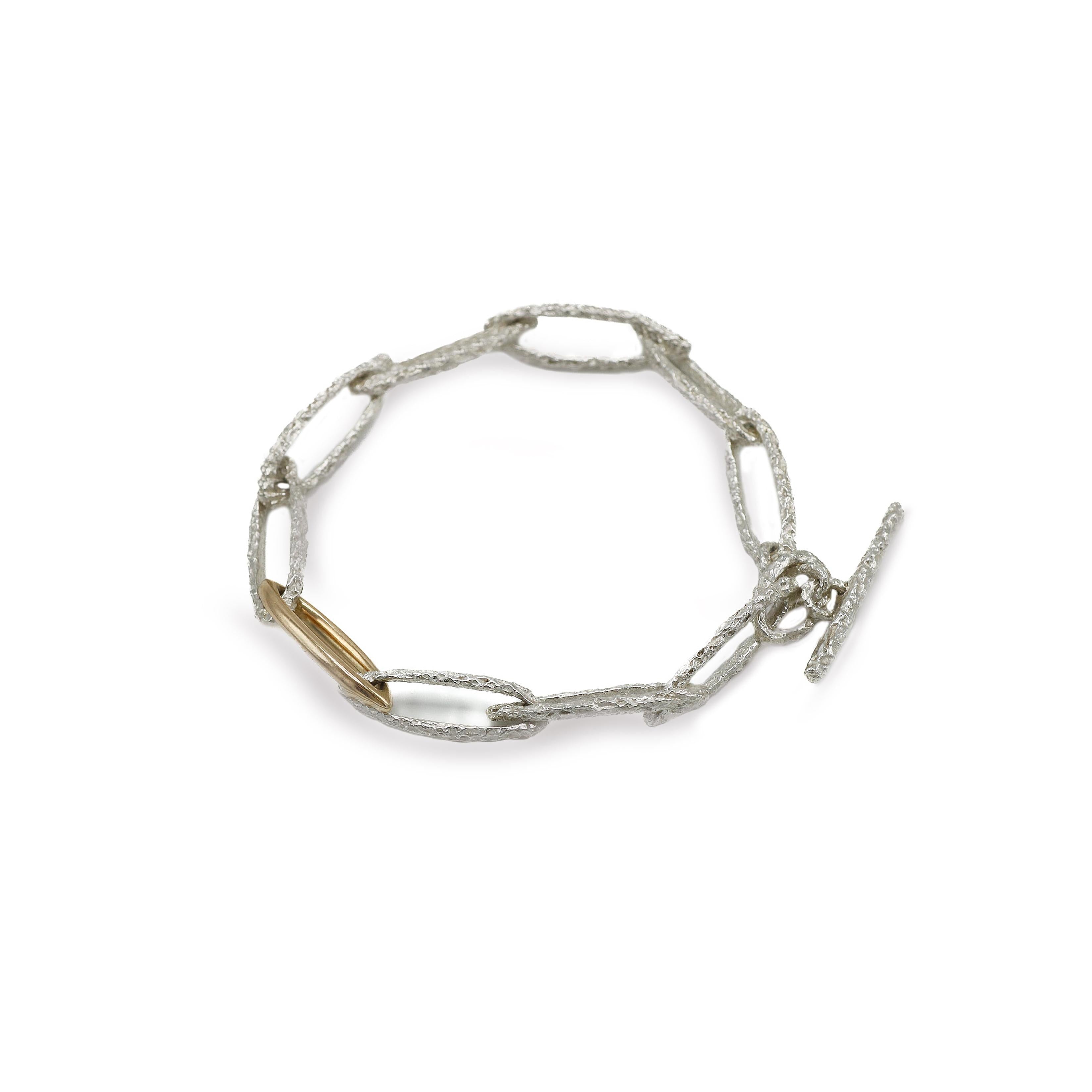 silver and gold textured link bracelet 