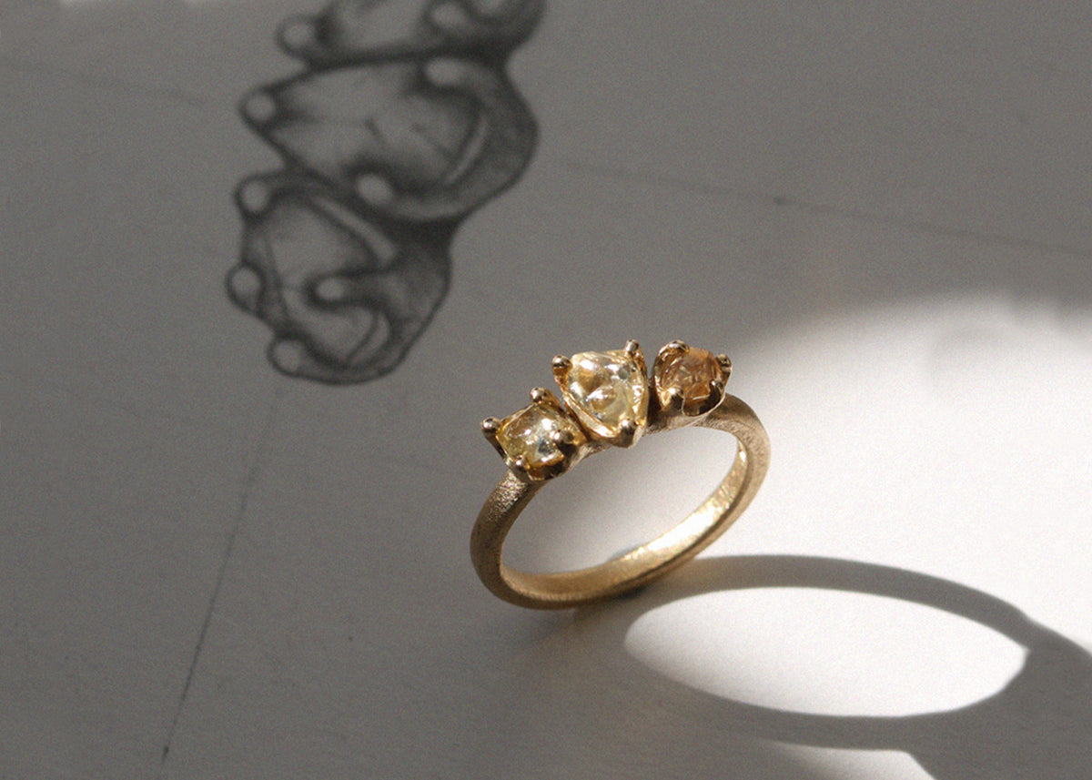 A bespoke jewellery design of a gold engagement ring