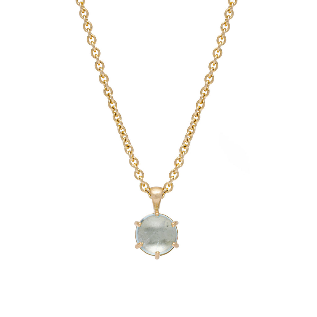Gold necklace with a round Aquamarine Cabochon pendant on a white background