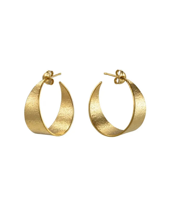 Gold hoop earrings on a white background