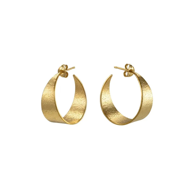 Gold hoop earrings on a white background