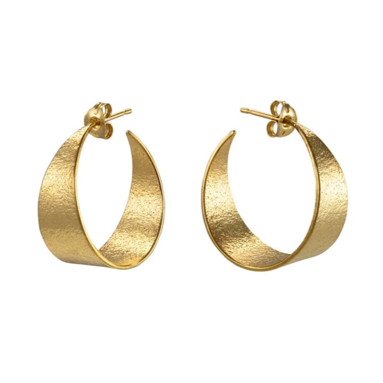 Gold hoop earrings on a white background