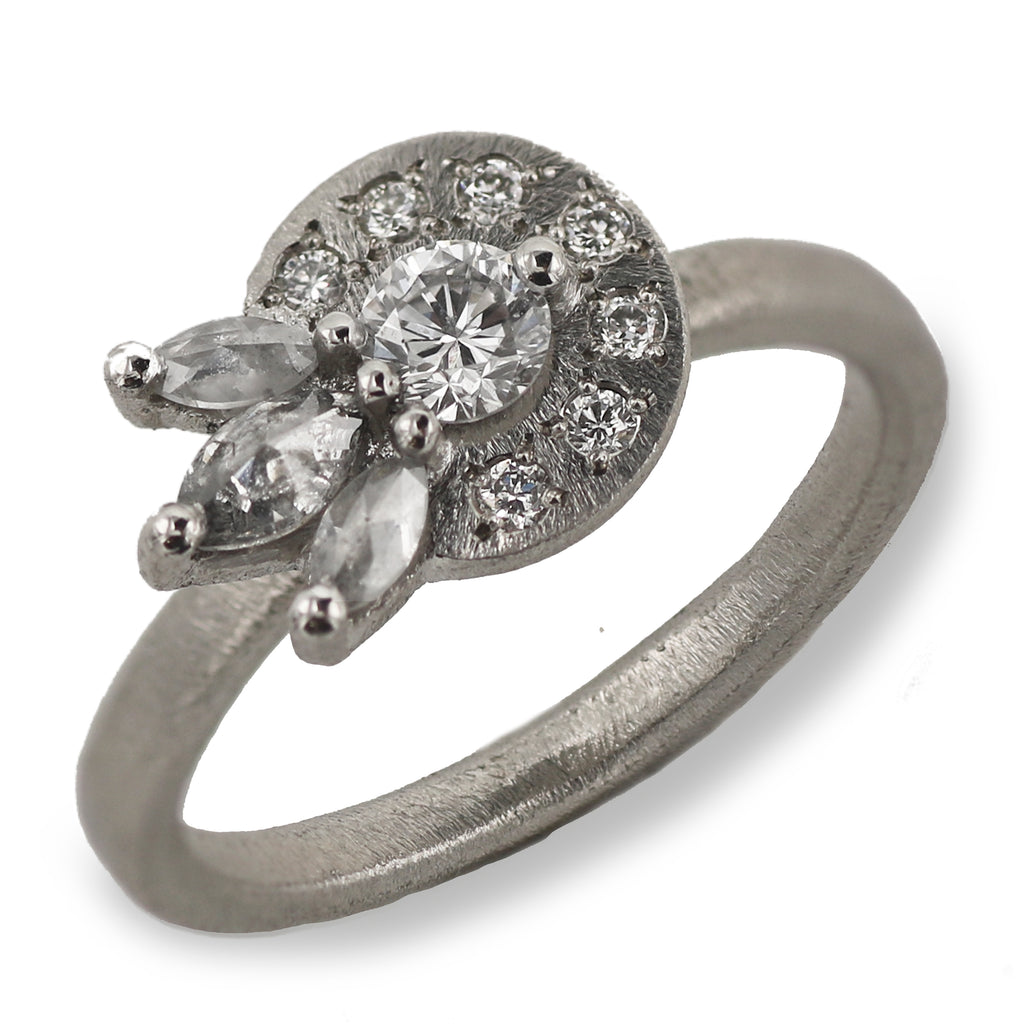 Collaboration Platinum Ring set with a Halo of Diamonds