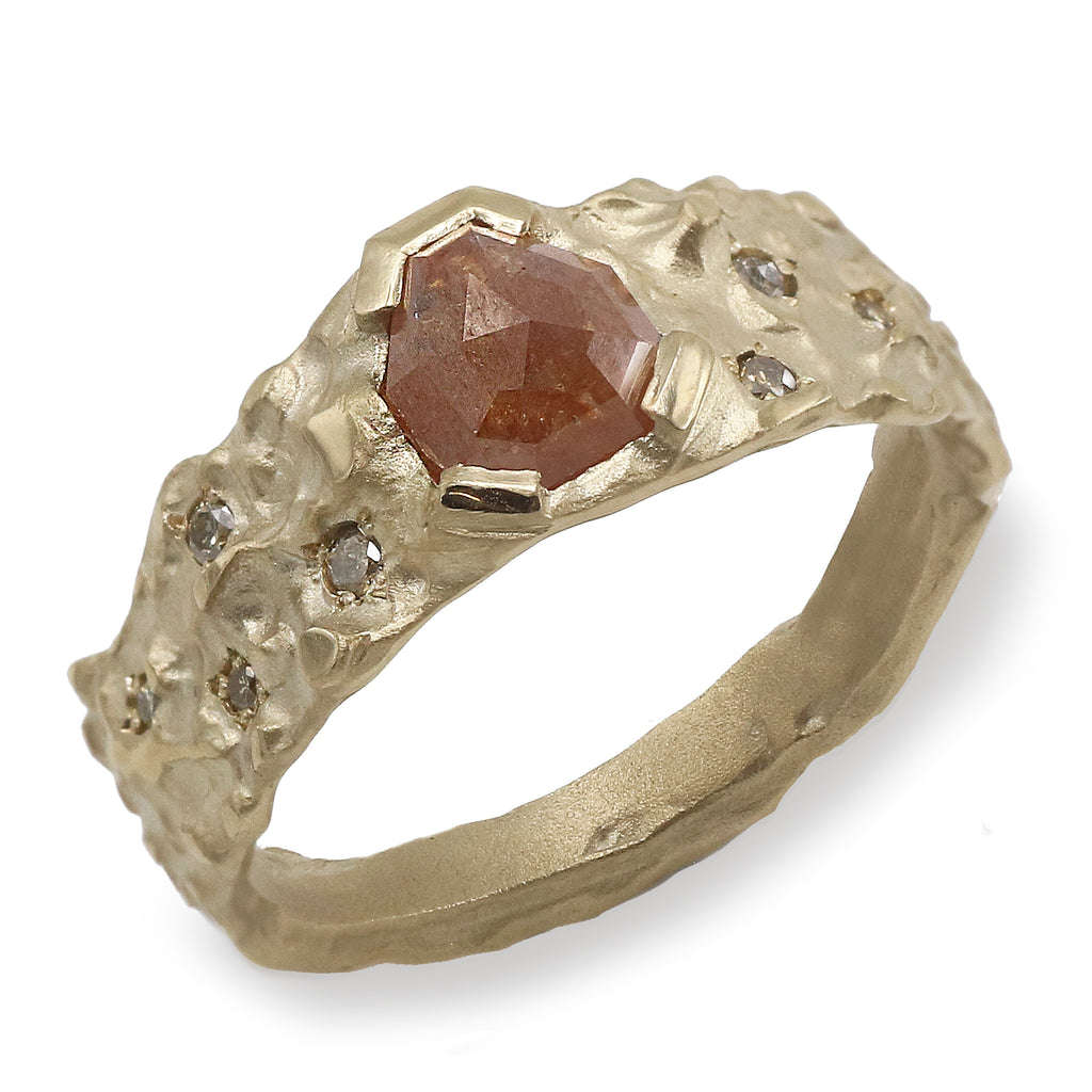 gold molten ring with unique shaped brown diamonds on w white background 