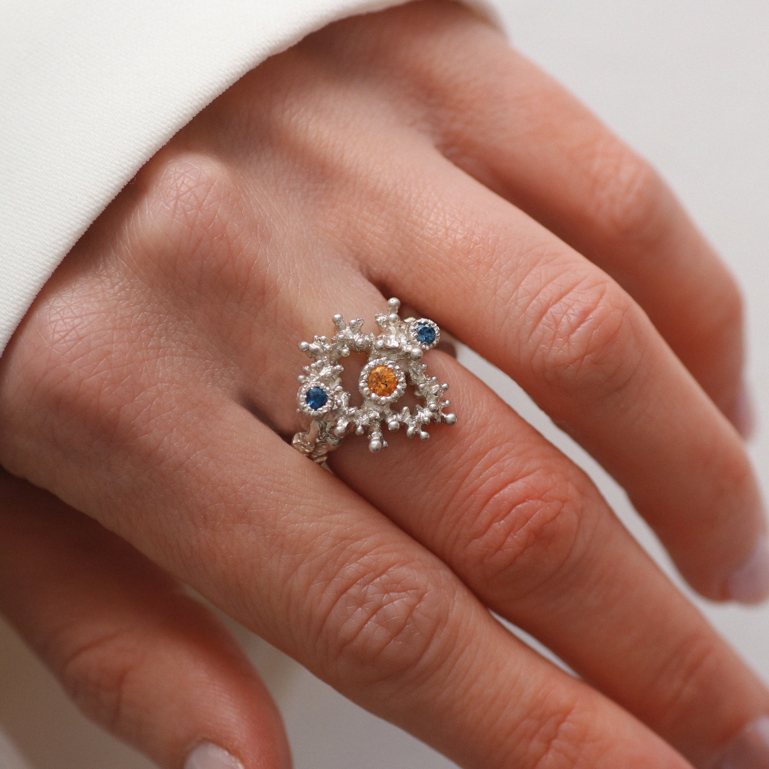 Lukas Svyba Silver Stamen Twilight Ring with Orange and Blue Sapphires