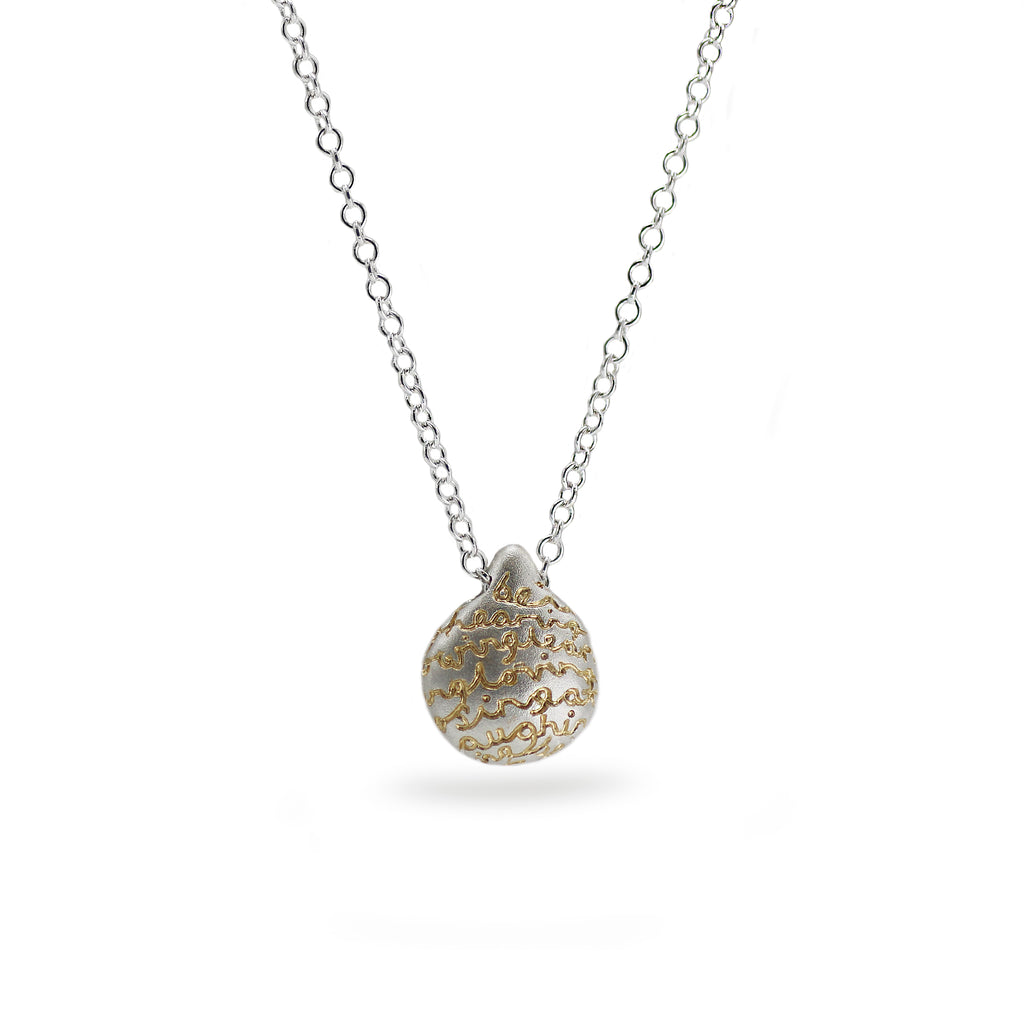 silver pebble pendant with gold words on white background